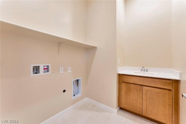 laundry area featuring sink, electric dryer hookup, gas dryer hookup, hookup for a washing machine, and light tile patterned floors