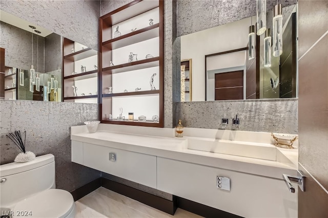 bathroom with tile walls, tile floors, vanity, and toilet