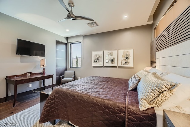 bedroom with ceiling fan and wood-type flooring