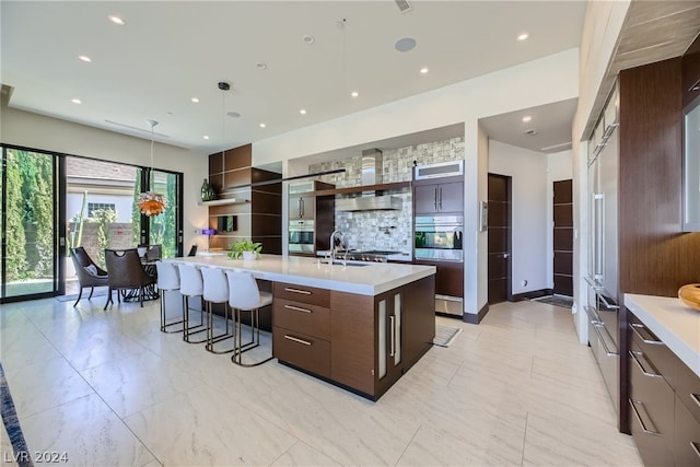 kitchen featuring light countertops, modern cabinets, and oven