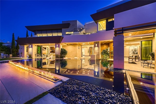 view of front of home featuring stucco siding and a patio