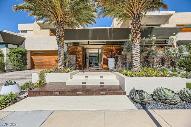 doorway to property with stucco siding