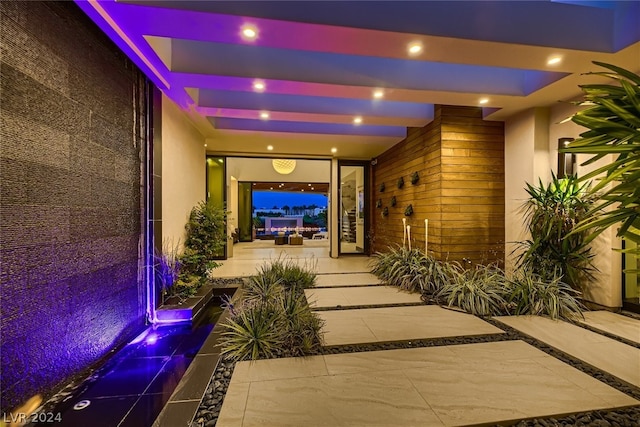 property entrance with stucco siding