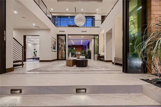 lobby featuring stairs and visible vents