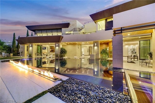 exterior space with a patio area and stucco siding