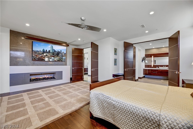 bedroom featuring ceiling fan and hardwood / wood-style flooring