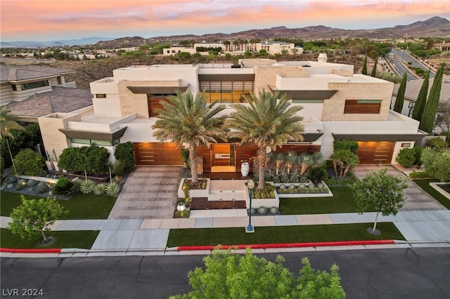 view of front of home featuring a mountain view and stucco siding