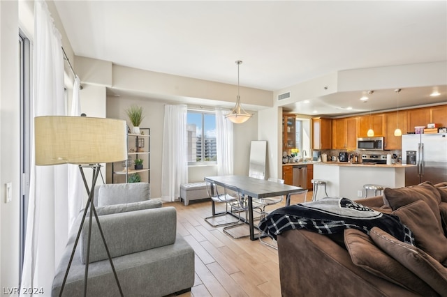 living room with light hardwood / wood-style flooring