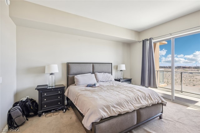 carpeted bedroom featuring access to exterior