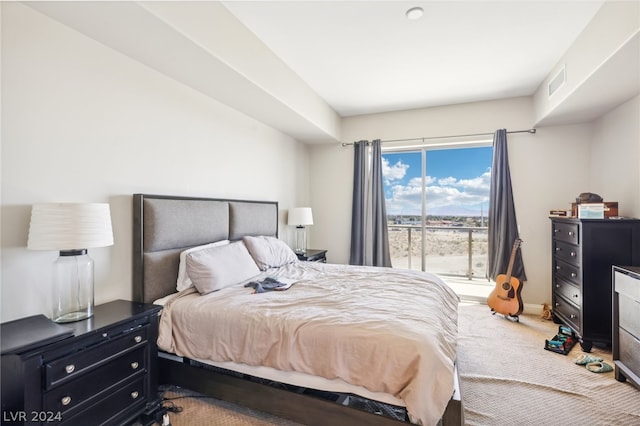 carpeted bedroom featuring access to outside