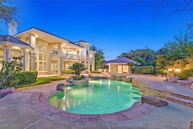 view of swimming pool featuring a patio area and pool water feature