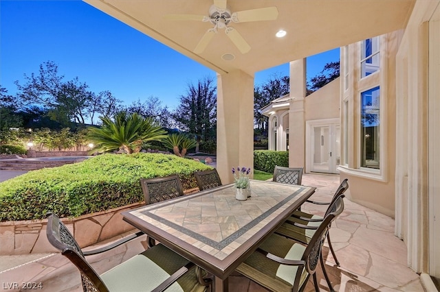 view of patio / terrace featuring ceiling fan