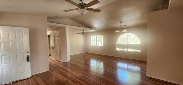 spare room featuring ceiling fan, dark hardwood / wood-style flooring, and vaulted ceiling