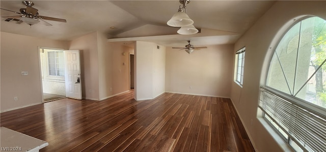 spare room featuring ceiling fan, vaulted ceiling, and dark hardwood / wood-style flooring