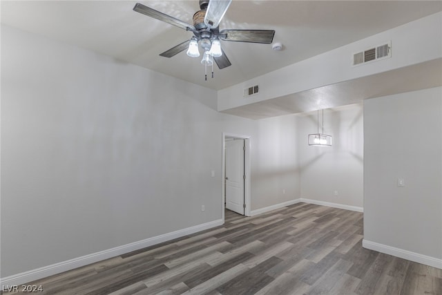 unfurnished room featuring hardwood / wood-style flooring and ceiling fan