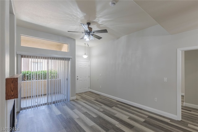 spare room featuring hardwood / wood-style floors and ceiling fan