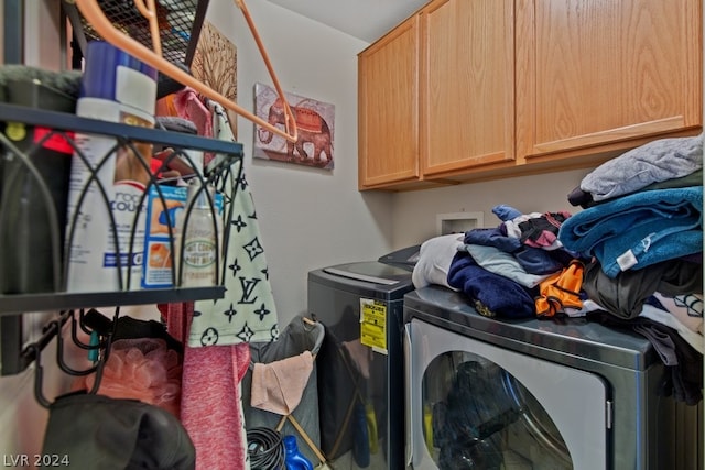 laundry area with cabinets, independent washer and dryer, and hookup for a washing machine