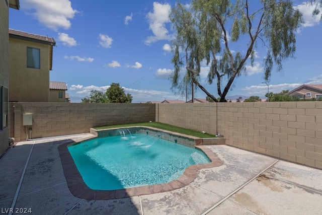 view of pool featuring a patio and pool water feature