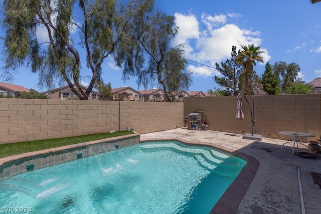 view of pool featuring a patio and pool water feature