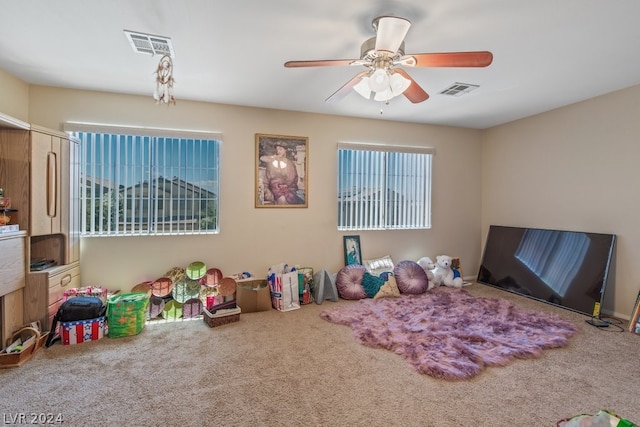 playroom featuring ceiling fan and carpet flooring