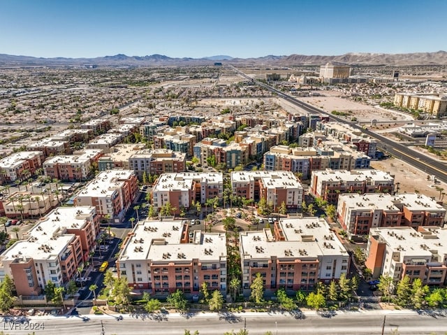 birds eye view of property with a mountain view