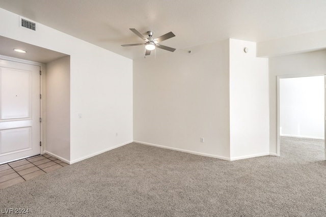 empty room with carpet and ceiling fan