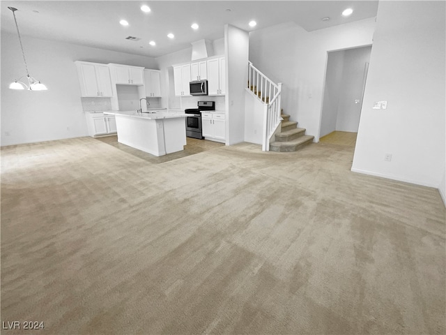 unfurnished living room with light colored carpet and sink