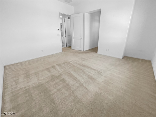 spare room with light carpet