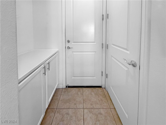 interior space with light tile patterned floors