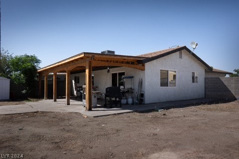 back of property with a patio area