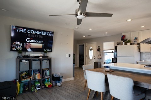 dining area featuring ceiling fan and hardwood / wood-style floors