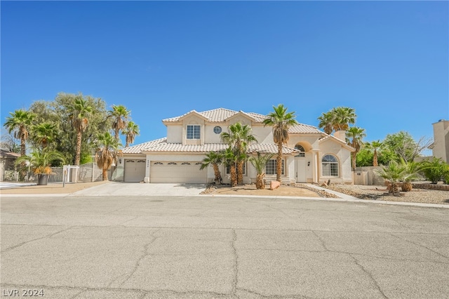 mediterranean / spanish house with a garage