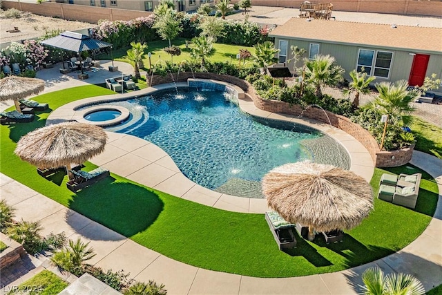 view of pool with a gazebo, pool water feature, and an in ground hot tub