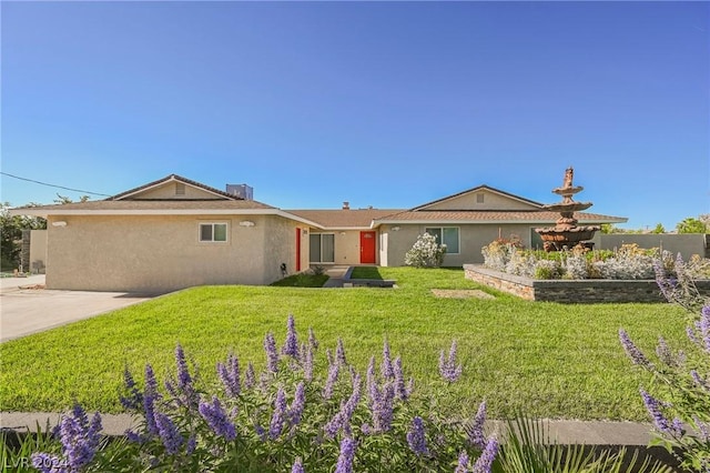 ranch-style house with a front lawn