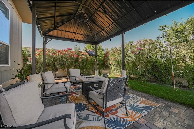 view of patio with a gazebo and an outdoor fire pit