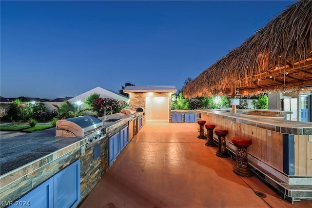 patio terrace at dusk with area for grilling