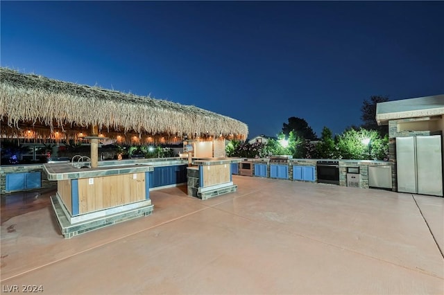 patio at twilight with area for grilling