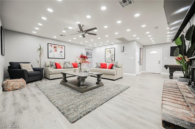 living room with light hardwood / wood-style flooring, ceiling fan, and pool table