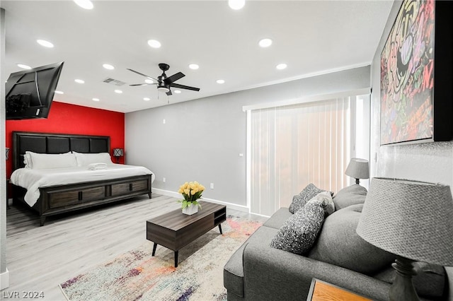 bedroom with ceiling fan and light hardwood / wood-style flooring