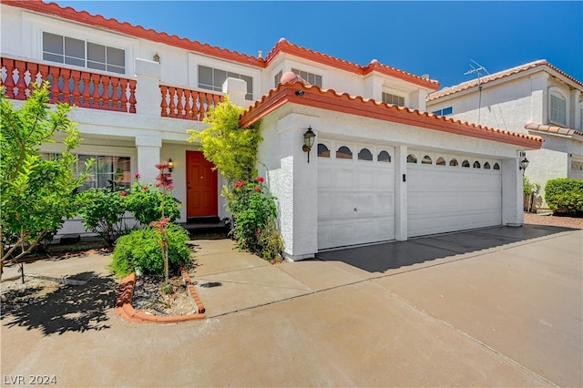 mediterranean / spanish-style home featuring a balcony