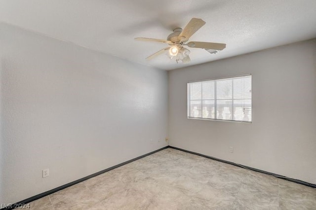 unfurnished room with ceiling fan