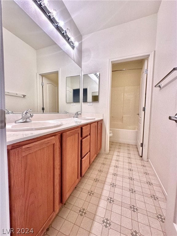 full bathroom with tile flooring, double vanity, toilet, and bathing tub / shower combination