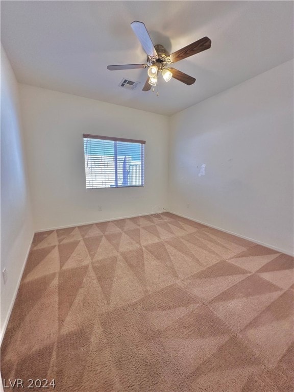 unfurnished room featuring carpet and ceiling fan