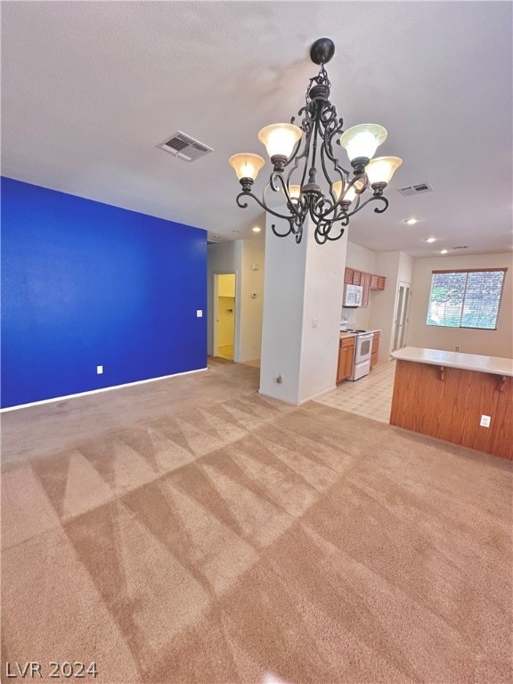 interior space featuring light carpet and a notable chandelier