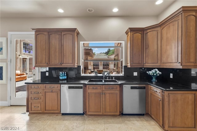 kitchen with sink, stainless steel dishwasher, decorative backsplash, and light tile patterned flooring