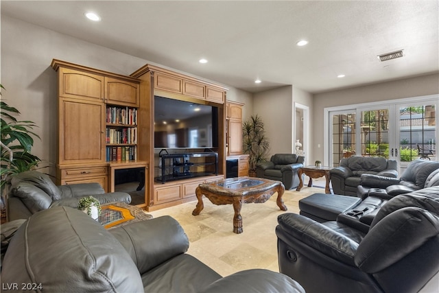 living room with french doors and light tile patterned floors