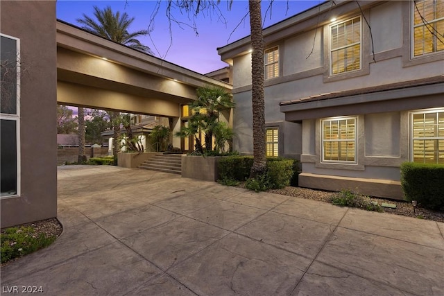 2785 S Monte Cristo Way, Las Vegas, NV 89117 - property exterior at dusk with stucco siding and stairs