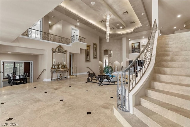 2785 S Monte Cristo Way, Las Vegas, NV 89117 - foyer entrance featuring arched walkways, stairs, a towering ceiling, recessed lighting, and a raised ceiling