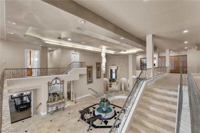 living room featuring a raised ceiling