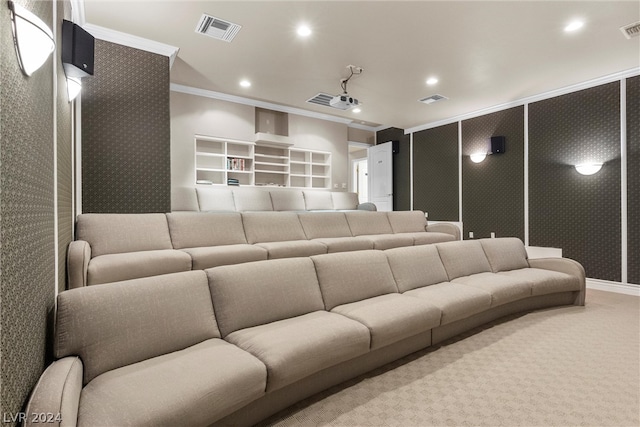 carpeted home theater with ornamental molding